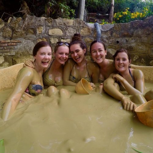 Vietnam Group Tour girls in mud bath